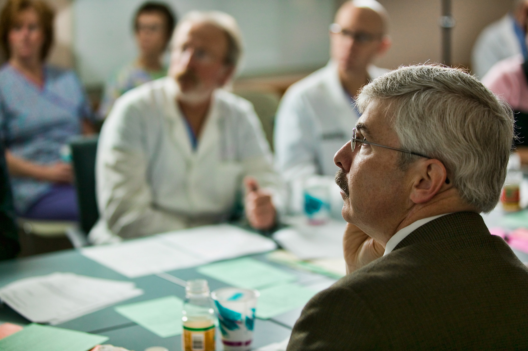 Cancer doctors collaborating in a conference room at Methodist Hospital  by Scott Dobry Pictures photographer in Omaha, Nebraska.
